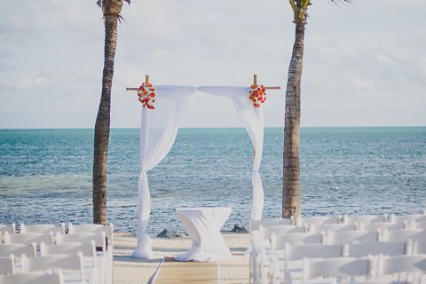 Wedding ceremony archway at beach.